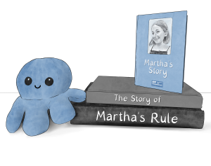 octopus teddy next to a pile of books that say "the story of Martha's Rule"